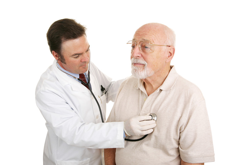 Elderly man getting his heart checked by a doctor in Dallas, TX